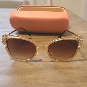 Gold sunglasses with diamonds on the side